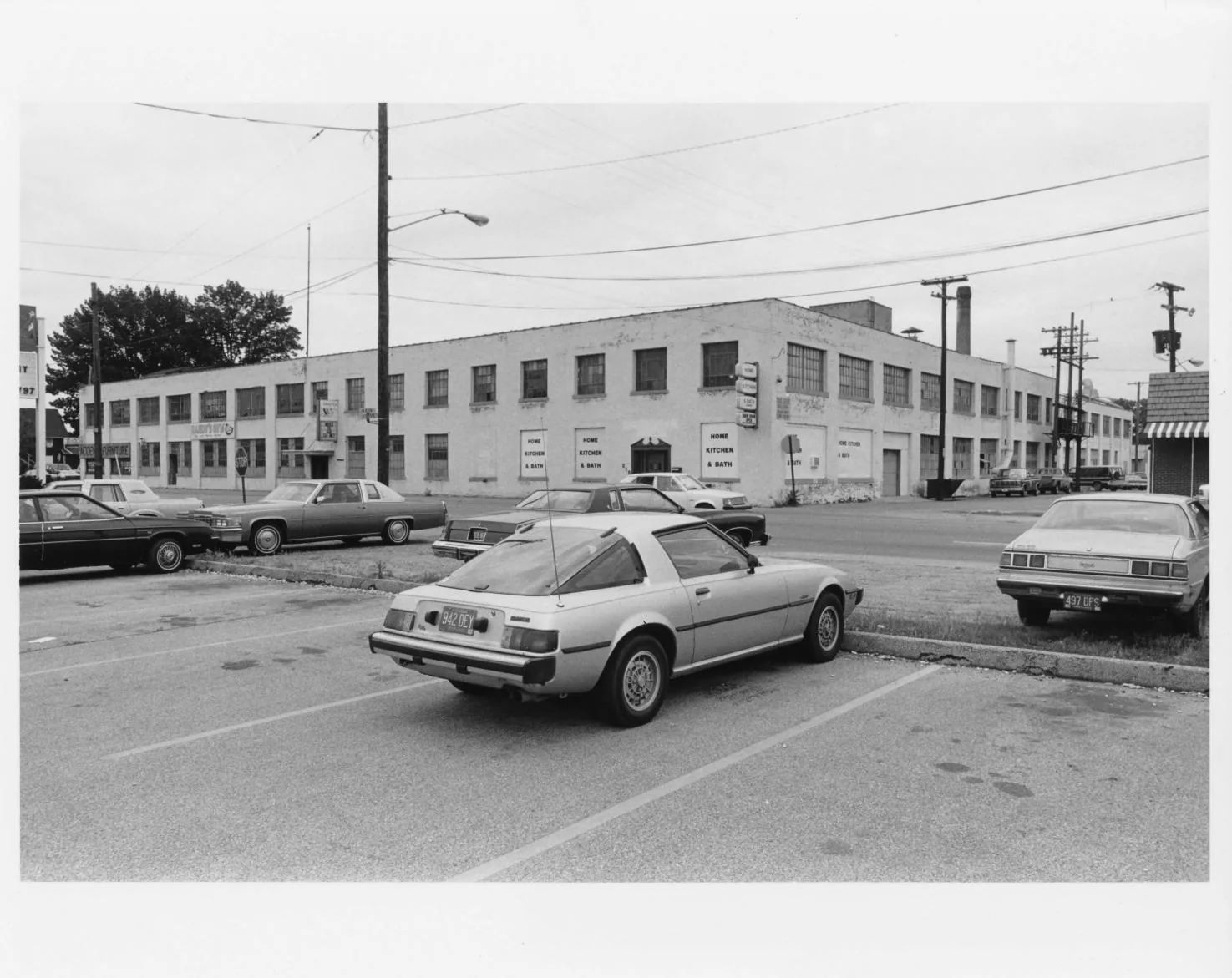 Black-and-white photographs of the Buescher Band Instrument Company Building, 1986: Exterior Southeast Corner (1986)
